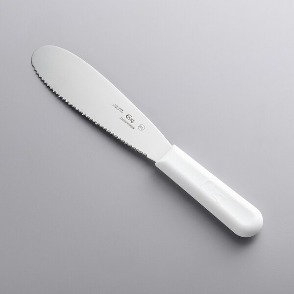 A Choice stainless steel sandwich spreader with a white handle.