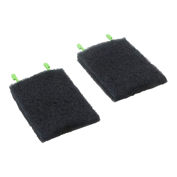 A pair of black Rational rough cleaning pads with green trim.