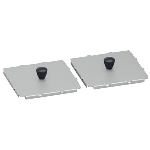 A pair of metal frames with black knobs on them.