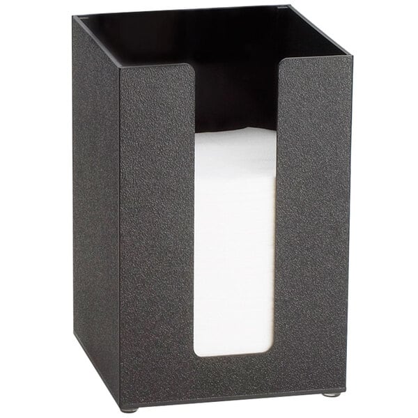 A black beverage napkin holder on a counter.