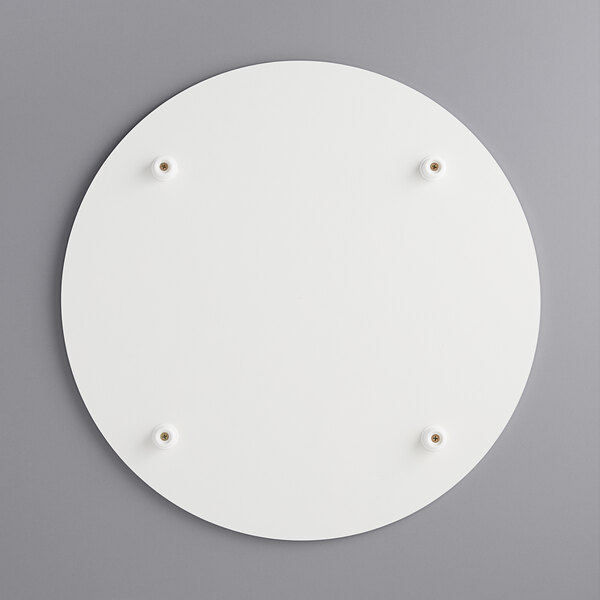 A white circular melamine-coated wood cake board with feet.