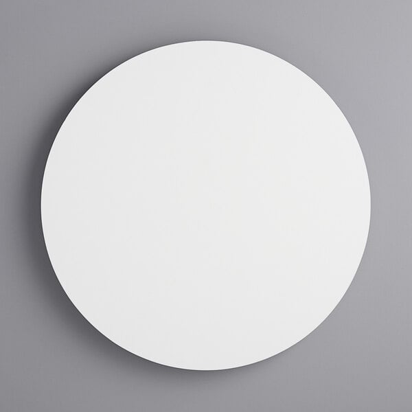A 14" white circular melamine-coated wood cake board with feet.