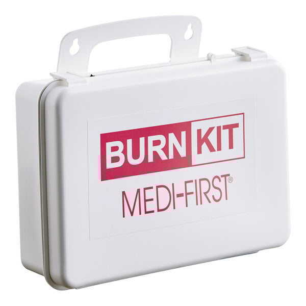 A white plastic burn kit case labeled 'Burn Kit Medi-First' with a handle for portability.
