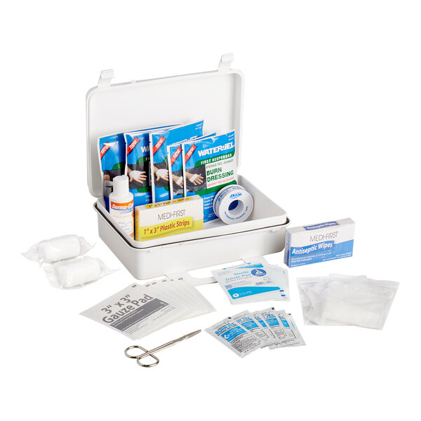 A plastic burn kit containing various first aid supplies such as burn dressings, antiseptic wipes, gauze pads, bandages, and scissors.