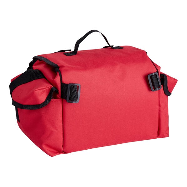 A large red trauma first aid kit bag with a handle and side pockets.