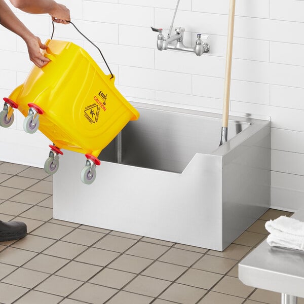 a yellow bucket with a wheelie on it