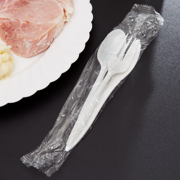 Individually-wrapped white plastic flatware