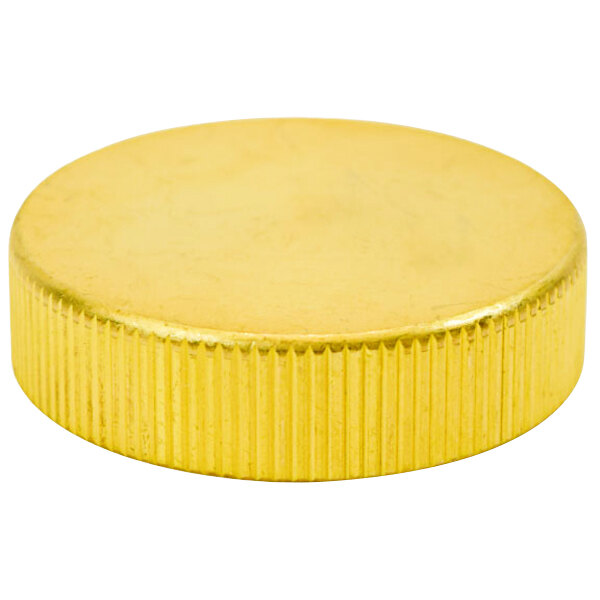 A gold cap with a white background.