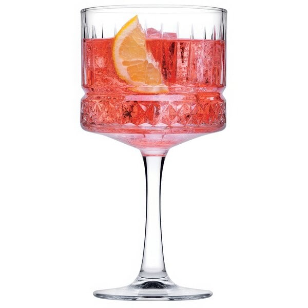 A Pasabahce Elysia gin and tonic glass filled with a drink and garnished with a slice of orange.