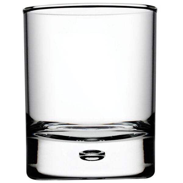 A close up of a Pasabahce Centra rocks glass with a small hole in the bottom.