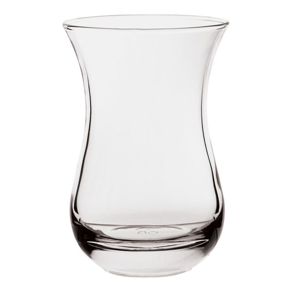 A Pasabahce clear glass with a curved edge.