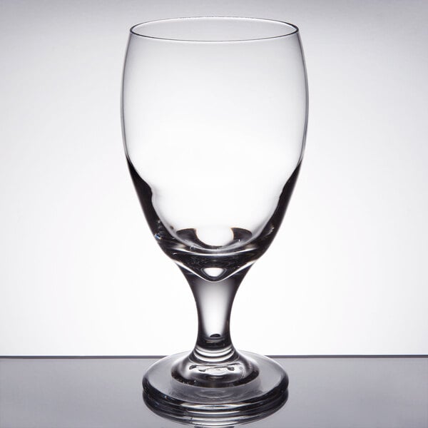 A clear Libbey tall drinking glass with a small rim on top.
