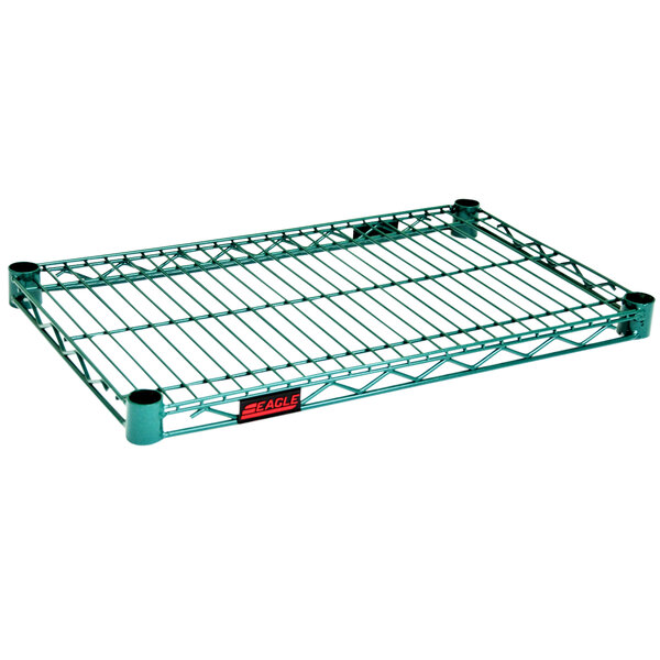 A green metal wire shelf with zinc supports.