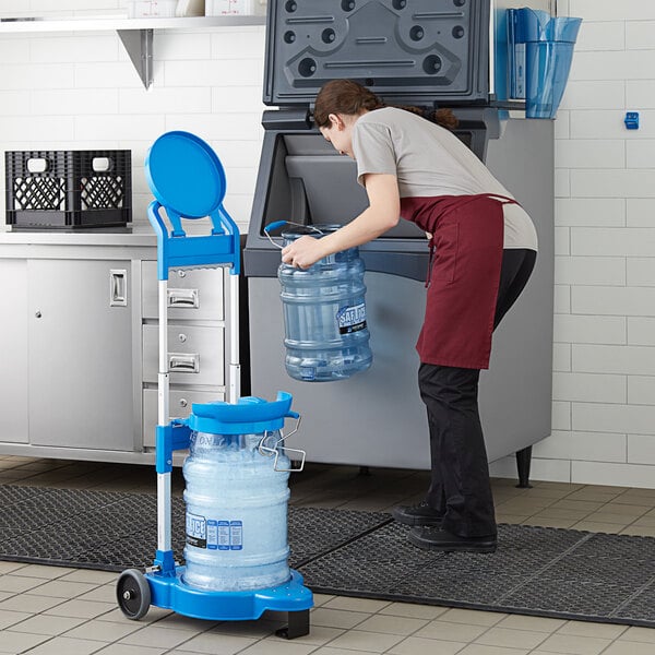 a woman wearing an apron and holding a water bottle