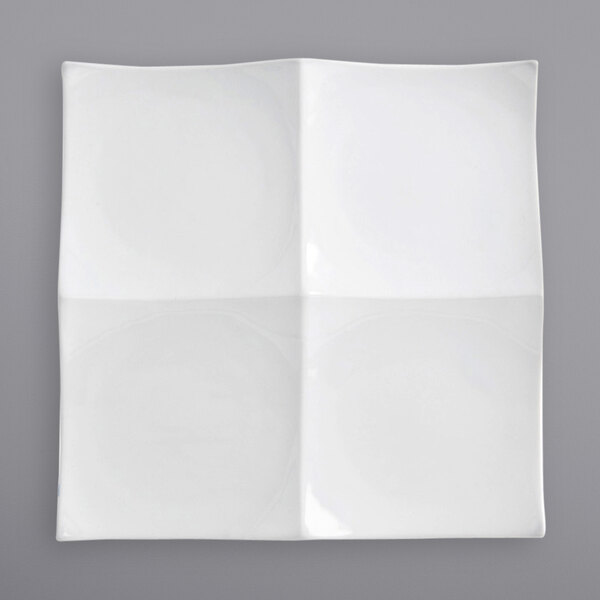 A white square Front of the House porcelain plate with four bright white circles inside.