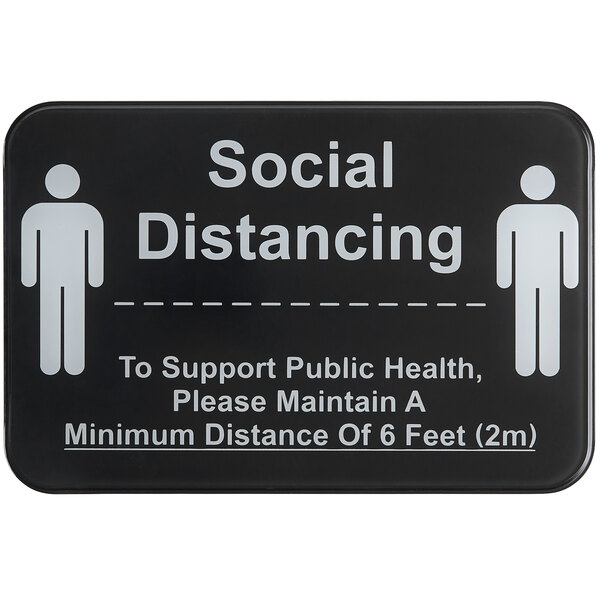 A black Tablecraft sign with white text reading "Social Distancing" and people icons.