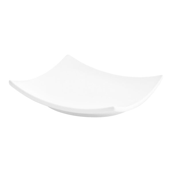 A small, bright white square porcelain plate with slightly upturned edges.