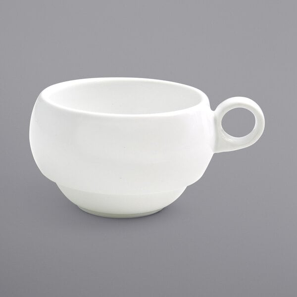 a white cup with a handle