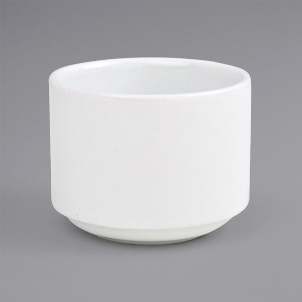 A white Front of the House Monaco porcelain ramekin on a gray surface.