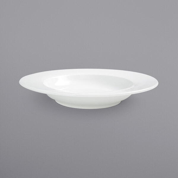 a white bowl with a spoon