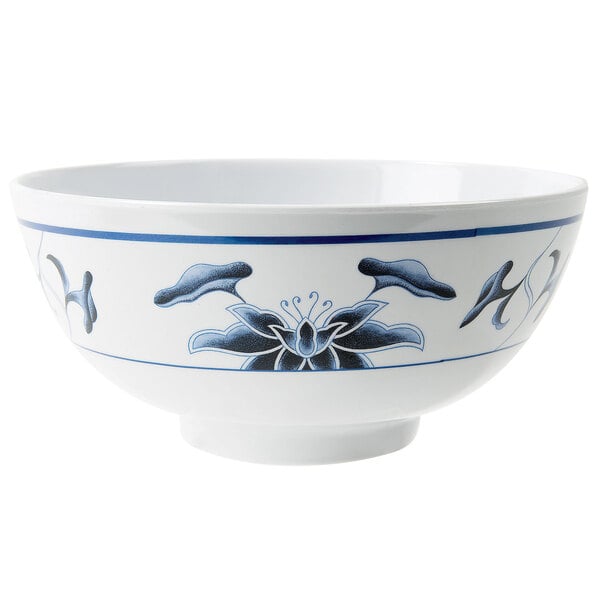 A white GET Water Lily melamine bowl with blue and white design.