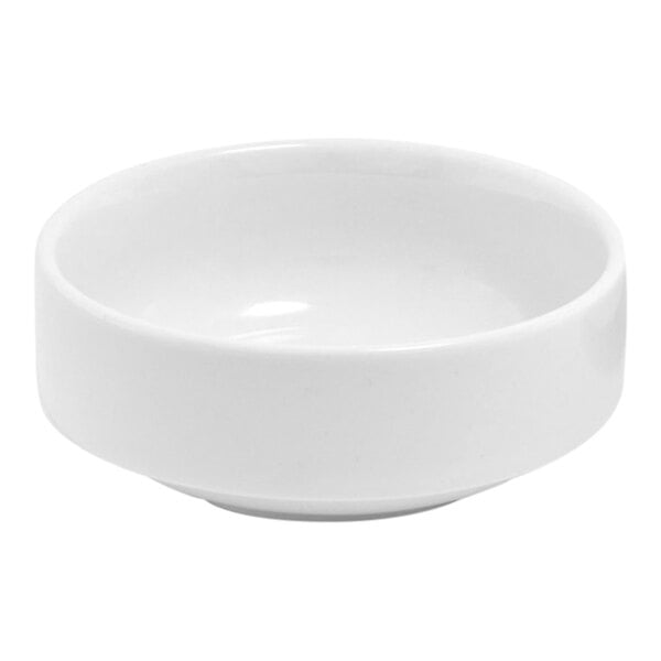 A small, round, bright white porcelain ramekin.