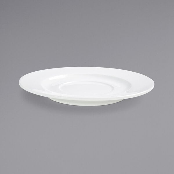 A close up of a Front of the House Monaco bright white porcelain saucer with a wide rim.