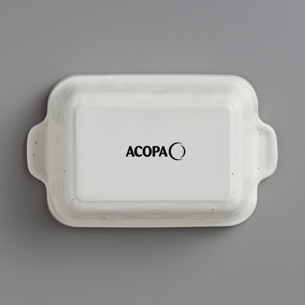 A white rectangular Acopa stoneware casserole dish with black text.