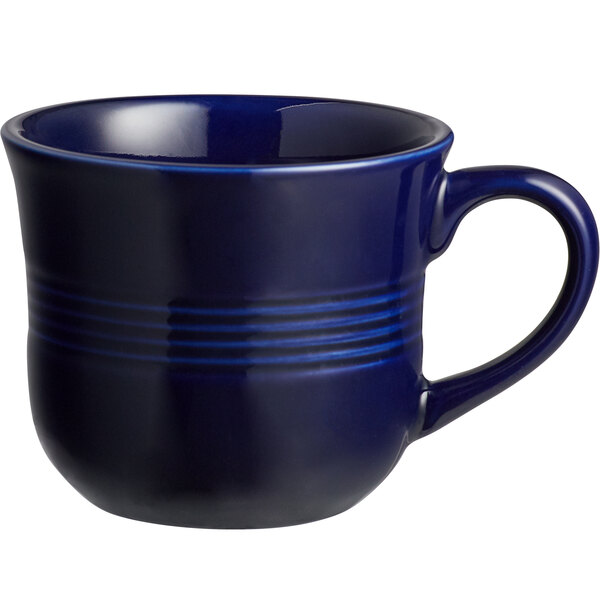 An Acopa Capri Deep Sea Cobalt coffee cup with a handle and stripes on it.