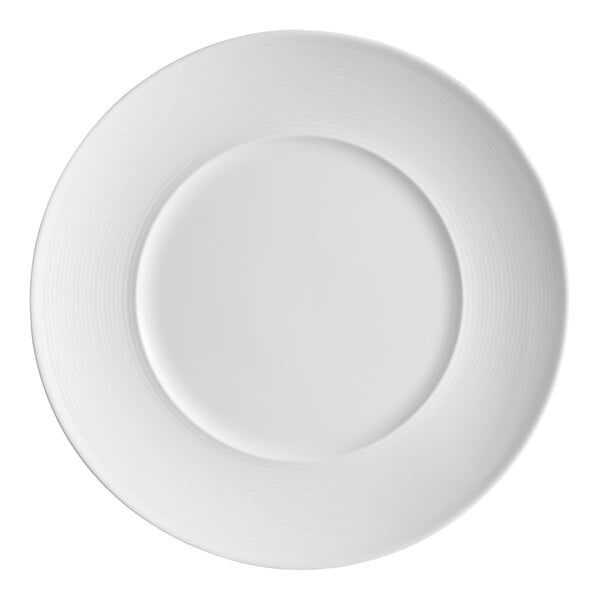 A bright white porcelain plate with embossed lines and a wide rim.