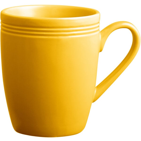 An Acopa Capri mango orange china mug with a handle.