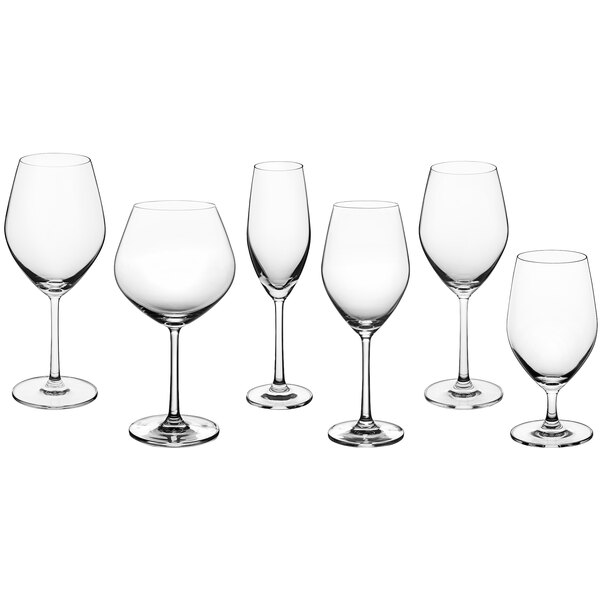 A group of clear Acopa Elevation flute glasses with stems.