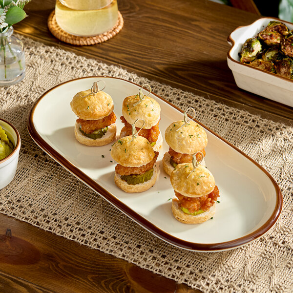 Acopa Keystone 14" x 6 3/4" Vanilla Bean Stoneware Oblong Coupe Platter - Sample