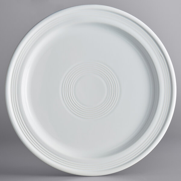 An Acopa Capri coconut white stoneware plate with a circular pattern.