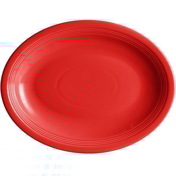 An oval red Acopa Capri stoneware platter with a rim.