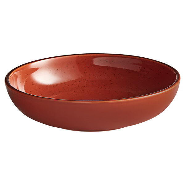 A brown bowl with a red rim and speckled specks.