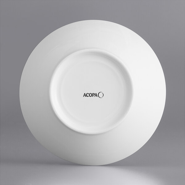 A close-up of a white Acopa Liana porcelain bowl with embossed lines.