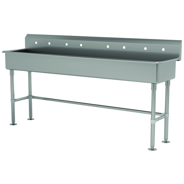 A grey stainless steel rectangular sink with 4 holes in the top.