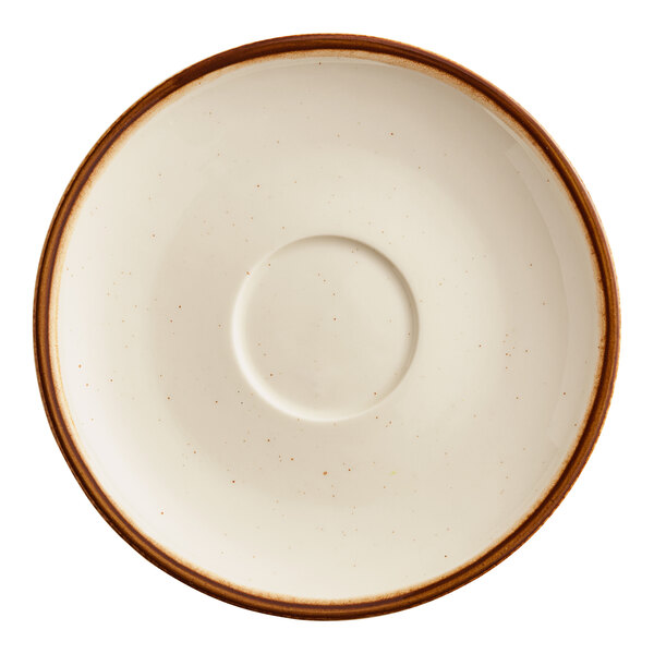 A round, cream-colored stoneware saucer with a brown rim and a central indentation for holding a cup.
