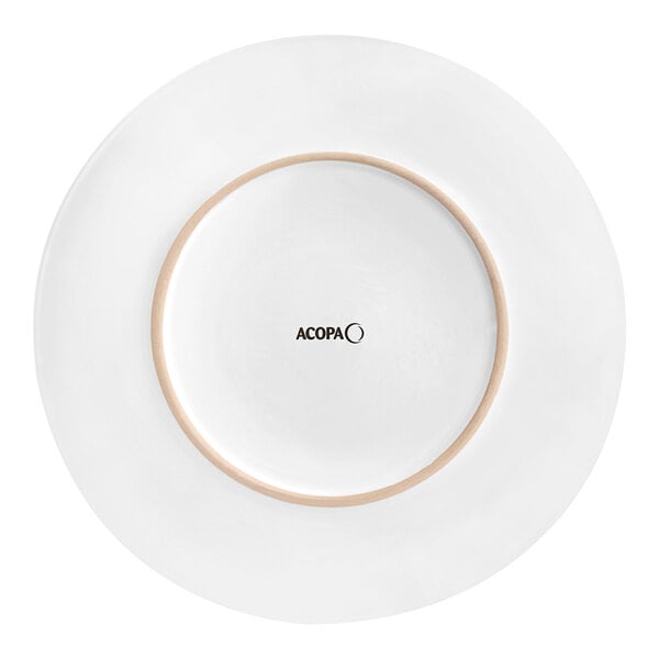 An Acopa bright white stoneware plate with a coupe shape.