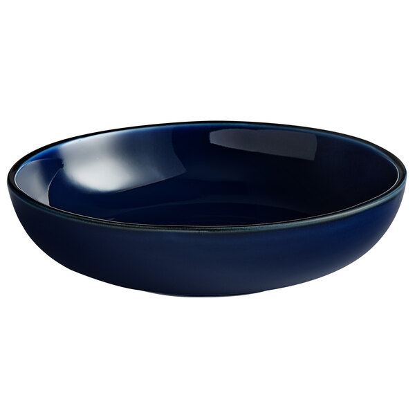An Acopa Keystone Azora Blue stoneware bowl with a black rim.