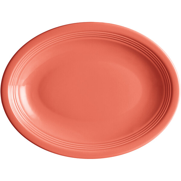 An Acopa Capri coral oval plate with a white background.