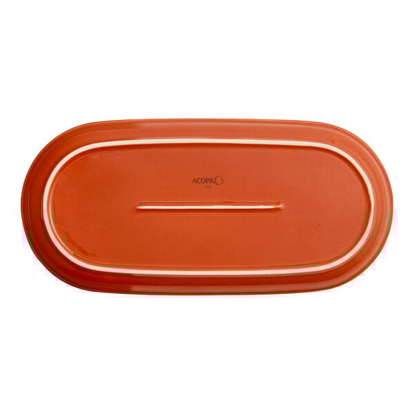 An orange stoneware oblong coupe platter.