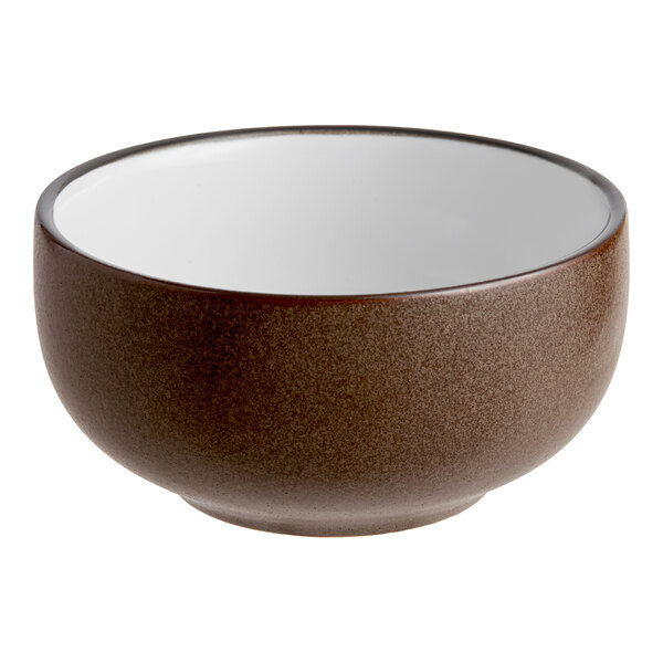 A brown matte stoneware bowl with a white interior.