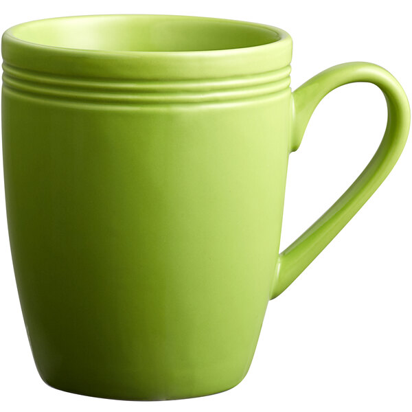 An Acopa Capri green bamboo mug with a handle.