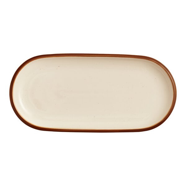 An oblong porcelain platter with a cream-colored surface and a brown rim.