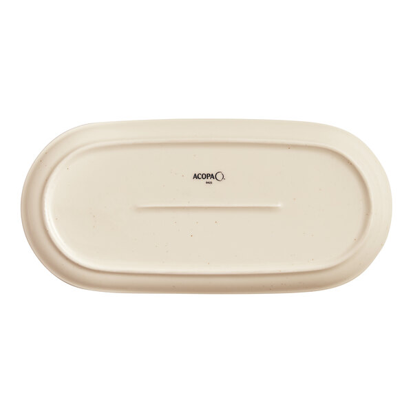 An oblong vanilla bean porcelain platter with a coupe edge, shown from the bottom.