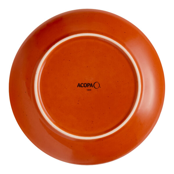 A round, orange stoneware coupe plate with the brand name 'Acopa' on the bottom.