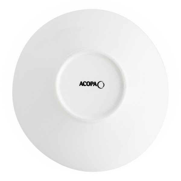 A close-up of a white Acopa porcelain bowl with black text reading "OKA" on it.