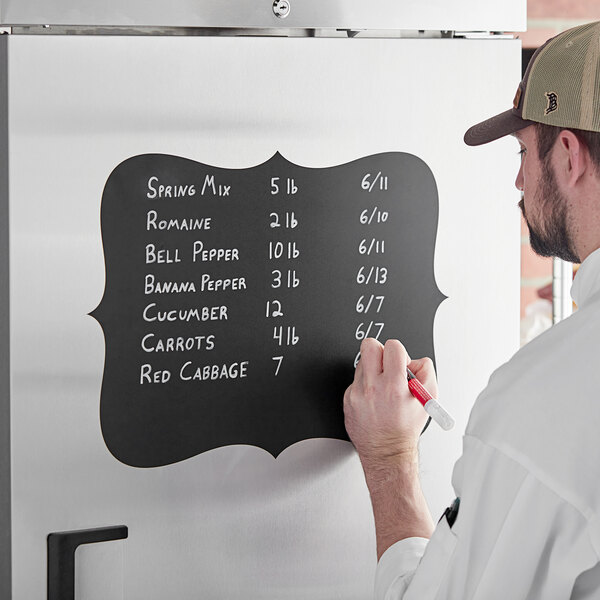 A man writing on a Choice decorative vinyl chalkboard label with a red and white pen.